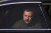 Ukraine's President Volodymyr Zelenskyy is seen in a car during a visit at a military air base in Soesterberg, Netherlands, Thursday, May 4, 2023. (Yves Herman/Pool via AP)