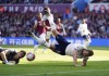 Tottenham's Harry Kane, right, goes down under a challenge from Aston Villa goalkeeper Emiliano Martinez which is then given as a penalty during the English Premier League soccer match between Aston Villa and Tottenham at Villa Park, Birmingham, England, Saturday, May 13, 2023. (David Davies/PA via AP)