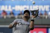 Chicago White Sox second baseman Elvis Andrus catches a fly ball for the out on Kansas City Royals' Edward Olivares during the third inning of a baseball game Wednesday, May 10, 2023, in Kansas City, Mo. (AP Photo/Charlie Riedel)