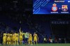 Barcelona players celebrate after the Spanish La Liga soccer match between Espanyol and Barcelona at the RCDE stadium in Barcelona, Sunday, May 14, 2023. (AP Photo/Joan Monfort)