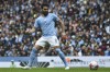 Manchester City's Ilkay Gundogan eyes the ball during the English Premier League soccer match between Manchester City and Leeds United at Etihad stadium in Manchester, England, Saturday, May 6, 2023. (AP Photo/Rui Vieira)