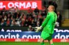 Hertha goalkeeper Oliver Christensen gestures to teammates, during the German Bundesliga soccer match between Cologne and Hertha Berlin at the RheinEnergieStadion in Cologne, Germany, Friday, May 12, 2023. (Federico Gambarini/dpa via AP)
