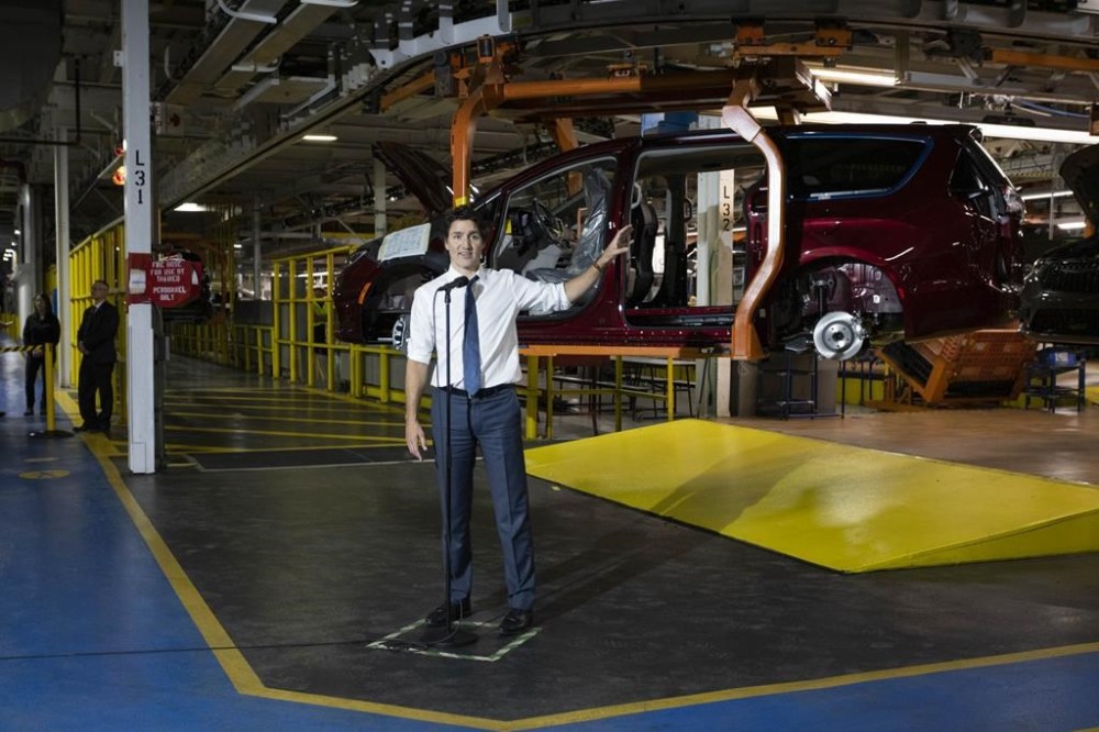 One of the world's largest automakers says it has stopped construction on an electric vehicle battery plant in Windsor, Ont., saying the federal government has not delivered on what was promised. Prime Minister Justin Trudeau tours the Stellantis Windsor (Chrysler) Assembly plant in Windsor, Ont., Tuesday, January 17, 2023. THE CANADIAN PRESS/Nicole Osborne