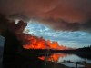 Fire and smoke from a wildfire are shown in Hay River, Northwest Territories in a handout photo. 
A First Nation reserve and nearby town in the southern Northwest Territories have been evacuated as a wildfire spreads in the area. THE CANADIAN PRESS/James Cardinal Jr. **MANDATORY CREDIT**