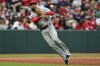 Los Angeles Angels third baseman Anthony Rendon throws to first for the out on Cleveland Guardians' Cam Gallagher during the fifth inning of a baseball game, Saturday, May 13, 2023, in Cleveland. (AP Photo/David Dermer)