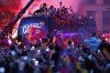 Barcelona team players celebrate on a bus during a parade to celebrate winning La Liga in Barcelona, Spain, Monday May 15, 2023. (AP Photo/Joan Monfort)