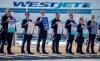 Members of the Air Line Pilots Association demonstrate amid contract negotiations outside the WestJet headquarters in Calgary, Alta., Friday, March 31, 2023.THE CANADIAN PRESS/Jeff McIntosh