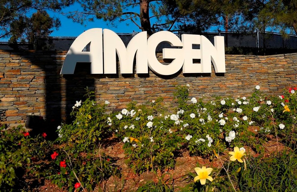 FILE - This photo shows signage outside the Amgen headquarters in Thousand Oaks, Calif on Nov. 9, 2014. Federal regulators are suing to block biotech drug developer Amgen’s more than $26 billion deal for Horizon Therapeutics. The Federal Trade Commission said Tuesday, May 16, 2023, that the deal, announced last December, would give Amgen unfair leverage to block competition for Horizon medications. (AP Photo/Mark J. Terrill, File)