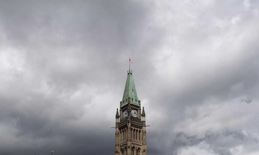 Storm clouds pass by the Peace Tower and Parliament Hill Tuesday August 18, 2020 in Ottawa.THE CANADIAN PRESS/Adrian Wyld