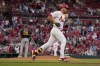 St. Louis Cardinals' Nolan Arenado, right, rounds the bases after hitting a solo home run off Milwaukee Brewers starting pitcher Wade Miley (20) during the second inning of a baseball game Tuesday, May 16, 2023, in St. Louis. (AP Photo/Jeff Roberson)