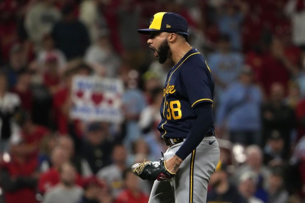 Milwaukee Brewers relief pitcher Devin Williams celebrates a 3-2 victory over the St. Louis Cardinals following a baseball game Tuesday, May 16, 2023, in St. Louis. (AP Photo/Jeff Roberson)