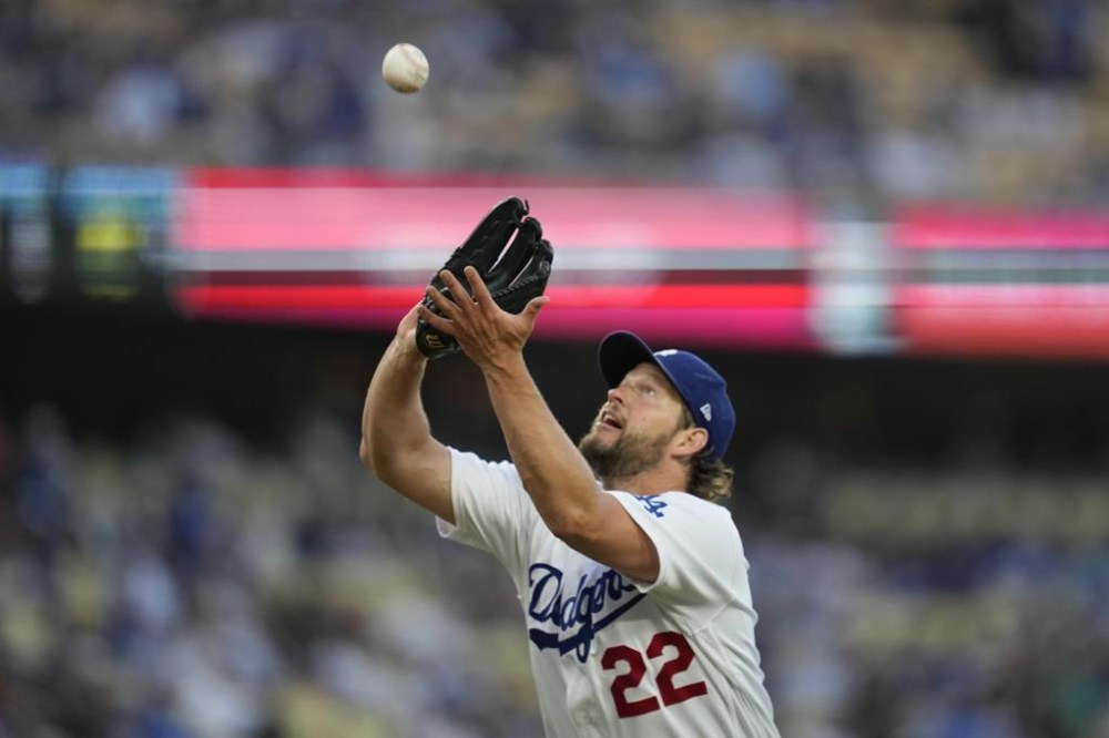 Los Angeles Dodgers starting pitcher Clayton Kershaw (22) catches a pop fly hit by Minnesota Twins' Ryan Jeffers during the first inning of a baseball game in Los Angeles, Tuesday, May 16, 2023. (AP Photo/Ashley Landis)