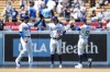 Los Angeles Dodgers left fielder Trayce Thompson (25), center fielder James Outman (33), and right fielder Mookie Betts (50) celebrate after a 7-3 win over the Minnesota Twins in a baseball game in Los Angeles, Wednesday, May 17, 2023. (AP Photo/Ashley Landis)