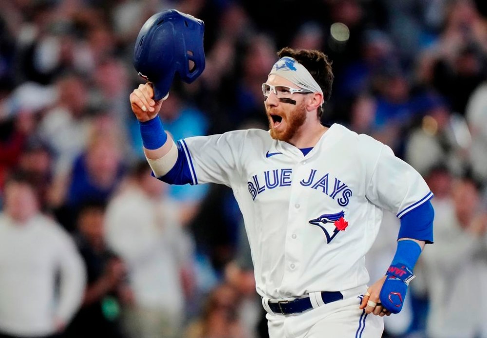 Toronto Blue Jays designated hitter Danny Jansen (9) celebrates his walk off three-run home run against the New York Yankees during 10th inning MLB American League baseball action in Toronto, on Wednesday, May 17, 2023. THE CANADIAN PRESS/Frank Gunn
