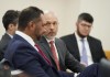 Erica Herman's attorneys Zachary Potter, center, and Benjamin Hodas, front, discuss Herman's case in Circuit Judge Elizabeth Metzger's courtroom at the Martin County Courthouse in Stuart, Fla., Tuesday, May, 9, 2023. Attorneys for golf superstar Tiger Woods are expected to argue Tuesday during a court hearing that his ex-girlfriend's lawsuit against him should be halted because she signed a nondisclosure agreement requiring that any disagreements between them be settled in private by an arbitrator. Erica Herman, 39, is suing Woods to get out of the agreement, saying she was the victim of his sexual harassment. (Crystal Vander Weit/Pool via AP)