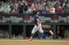 Atlanta Braves' Ronald Acuna Jr. celebrates his solo home run against the Texas Rangers as he rounds first during the sixth inning of a baseball game Wednesday, May 17, 2023, in Arlington, Texas. (AP Photo/Tony Gutierrez)
