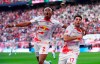 Leipzig's scorer Dominik Szoboszlai, right, and his teammate Mohamed Simakan, left, celebrate their side's second goal during the German Bundesliga soccer match between RB Leipzig and SV Werder Bremen in Leipzig, Germany, Sunday, May 14, 2023. Leipzig defeated Bremen by 2-1. ( Jan Woitas/dpa via AP)