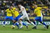 FILE - Real Madrid's Dani Ceballos, centrs, challenges for the ball with Cadiz's Luis Hernandez, centre left, and Fede San Emeterio, right, during the Spanish La Liga soccer match between Cadiz CF and Real Madrid at the Nuevo Mirandilla stadium in Cadiz, Spain, Saturday, April 15, 2023. With the Spanish league title already clinched by Barcelona, the focus now shifts to the drama at the bottom of the table. Cadiz hosts Valladolid on Friday, May 19, 2023 in a direct fight between two teams trying to stave off demotion. (AP Photo/Jose Breton, File)