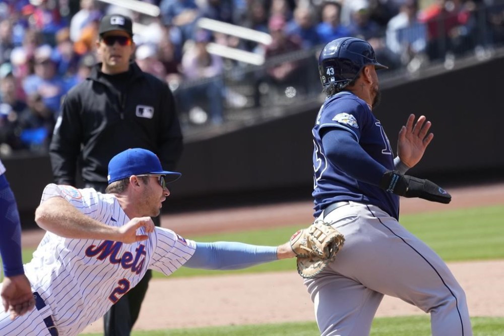 New York Mets first baseman Pete Alonso (20) tags out Tampa Bay Rays' Harold Ramirez during the sixth inning of a baseball game, Thursday, May 18, 2023, in New York. (AP Photo/Mary Altaffer)
