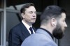 FILE - Elon Musk leave the Phillip Burton Federal Building and United States Court House in San Francisco, Jan. 24, 2023. In a letter issued Thursday, May 18, 2023, a lawyer for Twitter owner Musk accused Microsoft of misusing the service's data and demanded an audit from the software giant. The move could foreshadow legal action over earlier Musk allegations that Microsoft and its partner OpenAI 