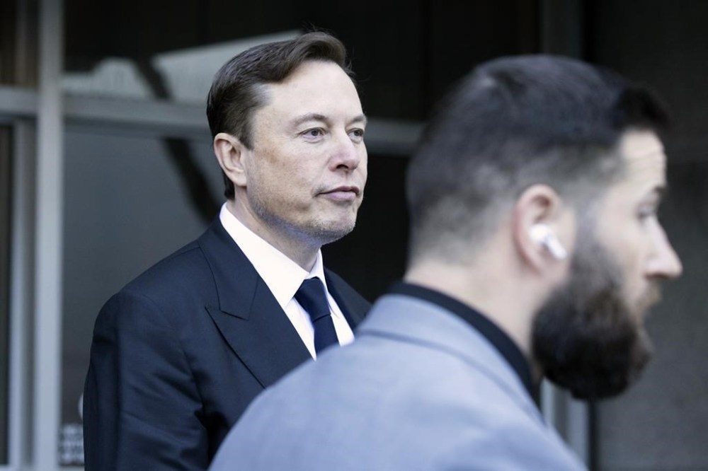 FILE - Elon Musk leave the Phillip Burton Federal Building and United States Court House in San Francisco, Jan. 24, 2023. In a letter issued Thursday, May 18, 2023, a lawyer for Twitter owner Musk accused Microsoft of misusing the service's data and demanded an audit from the software giant. The move could foreshadow legal action over earlier Musk allegations that Microsoft and its partner OpenAI
