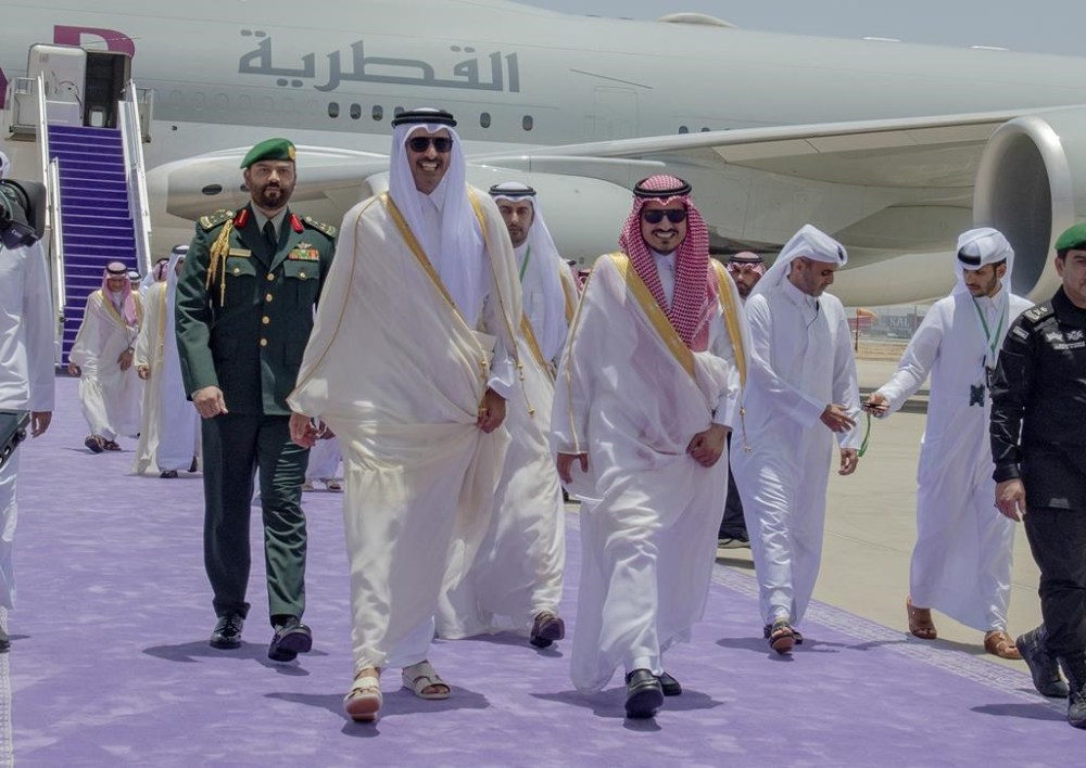 In this photo provided by Saudi Press Agency, SPA, Emir of Qatar Sheikh Tamim bin Hamad Al Thani is accompanied by Prince Badr Bin Sultan, deputy governor of Mecca, right, upon his arrival at Jeddah airport, Saudi Arabia, Friday, May 19, 2023, to attend the Arab summit. (Saudi Press Agency via AP)