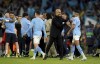 Manchester City manager Pep Guardiola with Riyad Mahrez at full time after the UEFA Champions League semi-final second leg match against Real Madrid at Etihad Stadium, Manchester. Man City beat Real Madrid 4-0 to advance to Champions League final. (Martin Rickett/PA via AP)