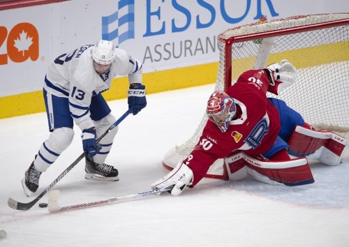 Laval Rocket goaltender Carey Price poke checks Toronto Marlies' Stefan Noesen during second period American Hockey League action in Montreal, Monday, May 17, 2021. The Marlies won't be renewing the contracts of head coach Greg Moore and assistants A.J. MacLean and John Snowden, the club announced Friday. THE CANADIAN PRESS/Ryan Remiorz