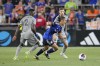 FC Cincinnati forward Yuya Kubo, center, dribbles against CF Montréal's Victor Wanyama (2) and Gabriele Corbo during the second half of an MLS soccer match Wednesday, May 17, 2023, in Cincinnati. THE CANADIAN PRESS/AP-Jeff Dean