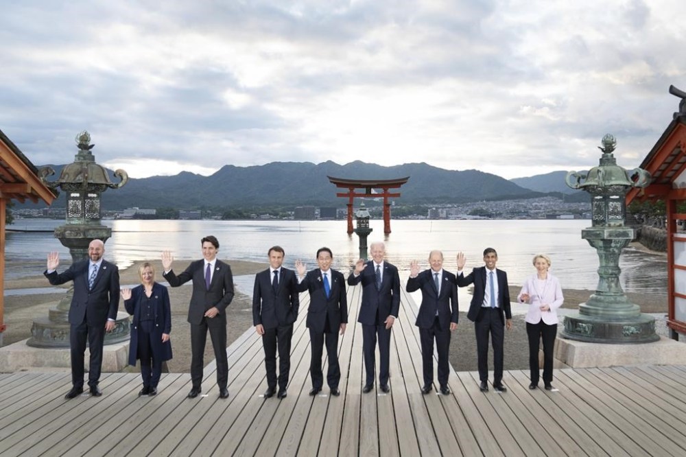 From left, European Council President Charles Michel, Italian Premier Giorgia Meloni, Canada's Prime Minister Justin Trudeau, French President Emmanuel Macron, Japanese Prime Minister Fumio Kishida, US President Joe Biden, German Chancellor Olaf Scholz, British Prime Minister Rishi Sunak and European Commission President Ursula von der Leyen pose for the family photo at the Itsukushima Shrine in Hiroshima, western Japan, Friday, May 19, 2023. (Stefan Rousseau/Pool Photo via AP)