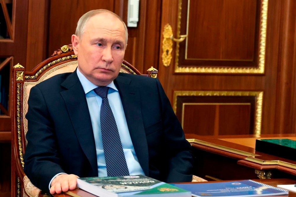 FILE - Russian President Vladimir Putin listens to Russian Human Rights ombudsman Tatyana Moskalkova during their meeting in Moscow, Russia, Monday, May 15, 2023. While the world awaits Ukraine's spring offensive, its leader Volodymyr Zelenskyy has already launched a diplomatic one. In a span of a week, he has dashed to Italy, the Vatican, Germany, France and Britain to shore up support for the defense of his country. Russian President Vladimir Putin, meanwhile, was at home, facing unprecedented international isolation, with an International Criminal Court arrest warrant hanging over his head and clouding the prospects of traveling to many destinations, including those viewed as allies. (Mikhail Klimentyev, Sputnik, Government Pool Photo via AP, File)