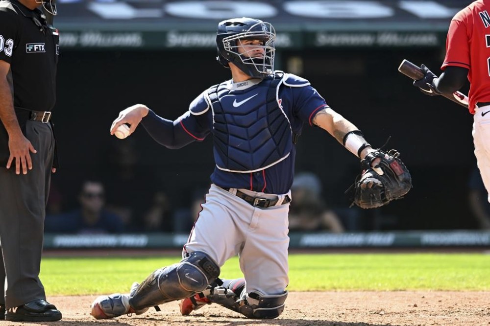 FILE - Minnesota Twins catcher Gary Sánchez (24) works behind the plate during the sixth inning of a baseball game against the Cleveland Guardians, Monday, Sept. 19, 2022, in Cleveland. Former All-Star catcher Gary Sánchez is back in the major leagues, this time with the New York Mets. Sánchez's contract was selected by the Mets on Friday, May 19, 2023, from Triple-A Syracuse, where he hit .308 with one homer, five RBIs, nine walks and 10 strikeouts in eight games. His deal calls for a $1.5 million salary while in the major leagues. (AP Photo/Nick Cammett, File)
