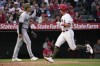 Los Angeles Angels' Zach Neto, right, scores on a sacrifice fly by Taylor Ward as Minnesota Twins starting pitcher Joe Ryan stands by during the third inning of a baseball game Friday, May 19, 2023, in Anaheim, Calif. (AP Photo/Mark J. Terrill)