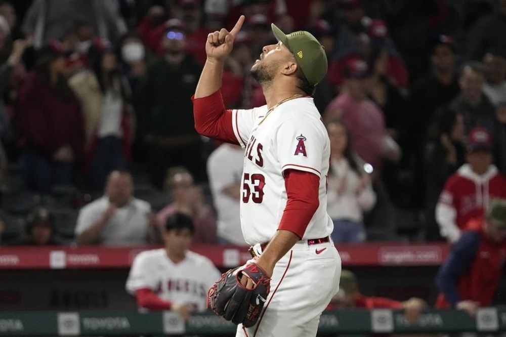 Los Angeles Angels relief pitcher Carlos Estevez gestures after the Angels defeated the Minnesota Twins 5-4 in a baseball game Friday, May 19, 2023, in Anaheim, Calif. (AP Photo/Mark J. Terrill)