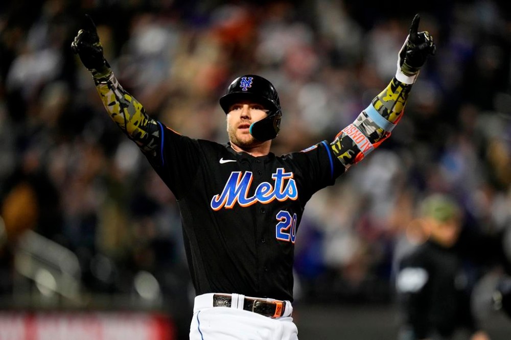 New York Mets' Pete Alonso celebrates after hitting a grand slam during the seventh inning of a baseball game against the Cleveland Guardians, Friday, May 19, 2023, in New York. (AP Photo/Frank Franklin II)