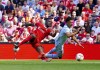 Liverpool's Ibrahima Konate, left, fouls Aston Villa's Ollie Watkins resulting in a penalty being given, during the English Premier League soccer match between Liverpool and Aston Villa, at Anfield stadium, Liverpool, England, Saturday May 20, 2023. (Peter Byrne/PA via AP)