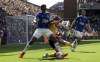 Wolverhampton Wanderers' Hwang Hee-chan, centre, and Everton's Yerry Mina battle for the ball during the English Premier League soccer match between Wolverhampton Wanderers and Everton at the Molineux Stadium, Wolverhampton, Saturday May 20, 2023. (Nick Potts/PA via AP)