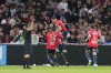 Lille's Jonathan David celebrates with teammates after scoring his side's opening goal during the French League One soccer match between Lille and Marseille at the Pierre Mauroy stadium in Lille, France, Saturday, May 20, 2023. (AP Photo/Michel Spingler)