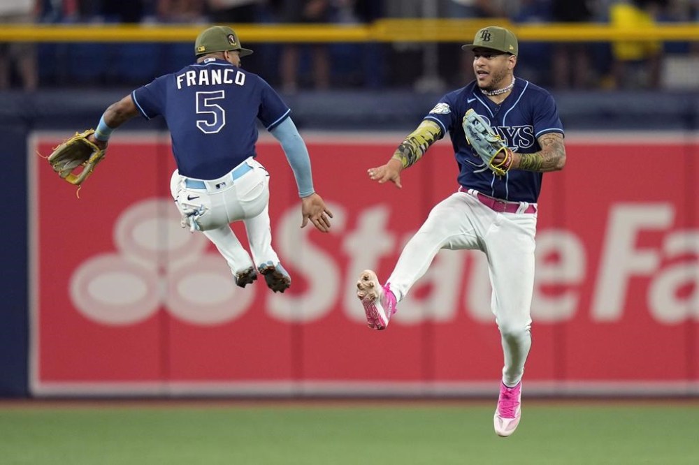 Tampa Bay Rays shortstop Wander Franco (5) celebrates with center fielder Jose Siri after the team defeated the Milwaukee Brewers during a baseball game Saturday, May 20, 2023, in St. Petersburg, Fla. (AP Photo/Chris O'Meara)