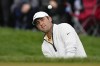 Scottie Scheffler chips to the green on the sixth hole during the third round of the PGA Championship golf tournament at Oak Hill Country Club on Saturday, May 20, 2023, in Pittsford, N.Y. (AP Photo/Eric Gay)