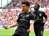 Stuttgart's Wataru Endo celebrates scoring during the Bundesliga soccer match between FSV Mainz 05 - VfB Stuttgart at Mewa Arena, in Mainz, Germany, Sunday May 21, 2023. (Torsten Silz/dpa via AP)