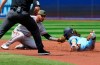 Baltimore Orioles shortstop Joey Ortiz (65) tags out Toronto Blue Jays Bo Bichette on a steal attempt of second base during first inning American League baseball action in Toronto on Sunday, May 21, 2023. THE CANADIAN PRESS/Frank Gunn