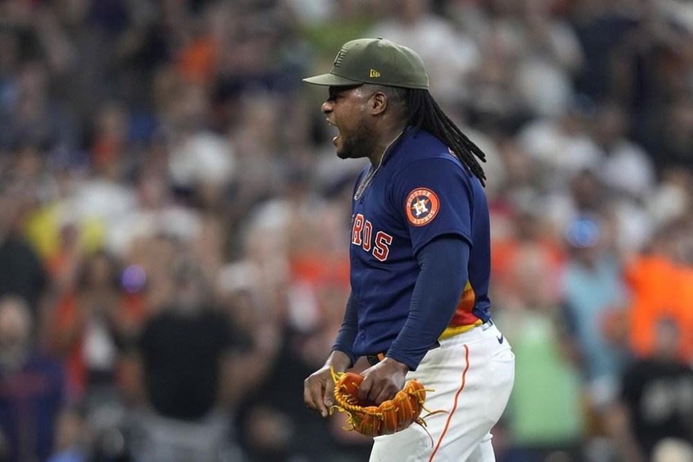 Houston Astros starting pitcher Framber Valdez celebrates after the final out during the ninth inning of a baseball game against the Oakland Athletics Sunday, May 21, 2023, in Houston. The Astros won 2-0. (AP Photo/David J. Phillip)