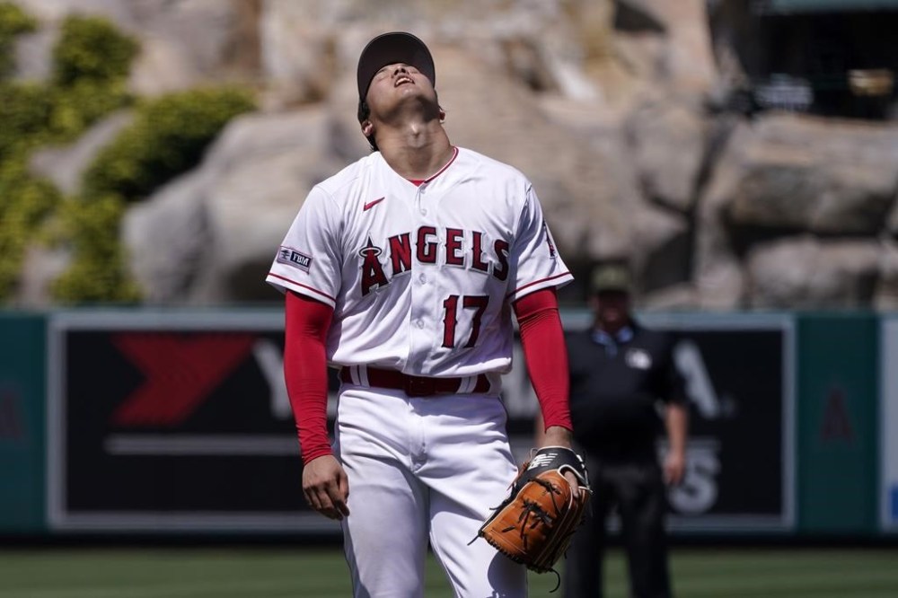 Los Angeles Angels starting pitcher Shohei Ohtani reacts after hitting Minnesota Twins' Ryan Jeffers with a pitch during the fifth inning of a baseball game Sunday, May 21, 2023, in Anaheim, Calif. (AP Photo/Mark J. Terrill)