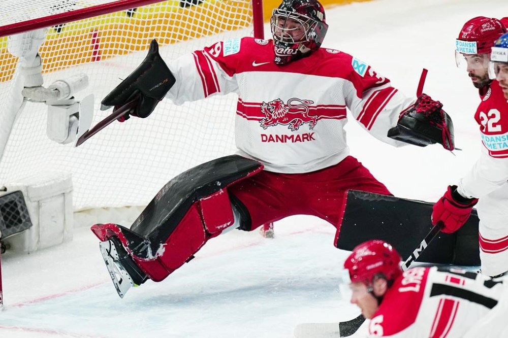 Denmark's goalie George Sorensen makes a save during the group A match between Denmark and Sweden at the ice hockey world championship in Tampere, Finland, Monday, May 22, 2023. (AP Photo/Pavel Golovkin)
