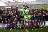 Barcelona players celebrate with the championship trophy on the pitch at the end of a Spanish La Liga soccer match between Barcelona and Real Sociedad at Camp Nou stadium in Barcelona, Spain, Saturday, May 20, 2023. Barcelona clinched the Spanish league title last Sunday with four rounds still to be played.(AP Photo/Joan Monfort)