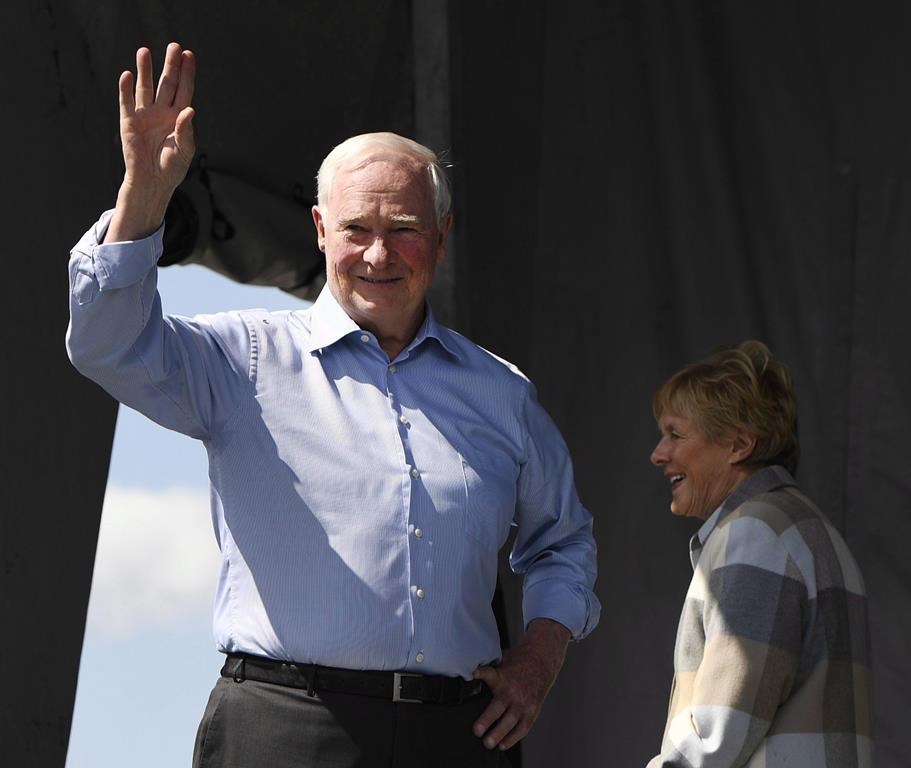 Gov.-Gen. David Johnston waves after speaking at the Great Trail Cross-Canada Connection Celebration in Ottawa, as his wife Sharon looks on, Saturday, Aug. 26, 2017. Johnston, the man charged with recommending how best to deal with foreign interference in Canada’s federal elections, will finally say today whether he believes a public inquiry is necessary. THE CANADIAN PRESS/Justin Tang