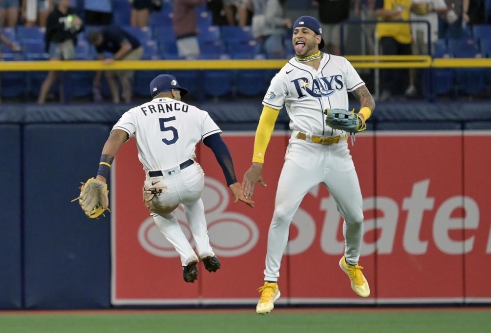 Tampa Bay Rays' Wander Franco (5) and Jose Siri celebrate after a win over the Toronto Blue Jays during a baseball game Monday, May 22, 2023, in St. Petersburg, Fla. (AP Photo/Steve Nesius)
