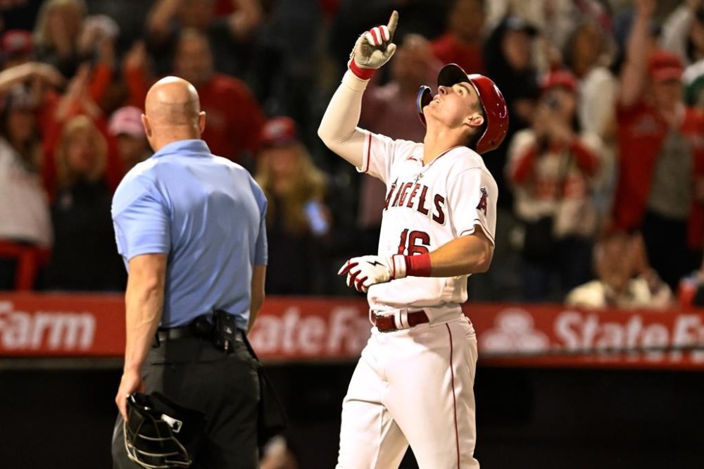 Los Angeles Angels' Mickey Moniak, right, points skyward after hitting a solo home run against the Boston Red Sox during the eighth inning of a baseball game in Anaheim, Calif., Monday, May 22, 2023. (AP Photo/Alex Gallardo)