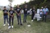 Alianza FC players attend the funeral of Alberto Antonio Palacios, one of the soccer fans that died in the recent Cuscatlan stadium stampede, during his burial at the Jardines del Recuerdo cemetery in San Salvador, El Salvador, Monday, May 22, 2023. The tragedy occurred when stampeding fans pushed through one of the access gates during a quarterfinal Salvadoran league soccer match between Alianza and FAS. Their t-shirts have a phrase that reads in Spanish 